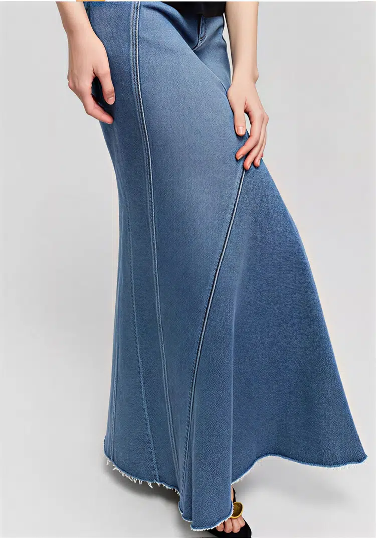 High - waisted denim mermaid skirt made of denim fabric, featuring a retro and elegant style with mermaid - shaped hem and frayed details, suitable for daily wear or creating elegant looks.