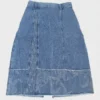 Embroidered patchwork denim midi skirt made of denim fabric, featuring embroidered details and frayed hem, with a casual style suitable for daily or vacation wear.