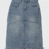 Frayed hem denim midi skirt made of denim fabric, featuring a casual style with frayed hem detail, suitable for daily wear.