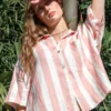 100% linen yarn - dyed pink and white striped loungewear shirt, part of a loungewear set, casual and comfortable design with outdoor greenery backdrop
