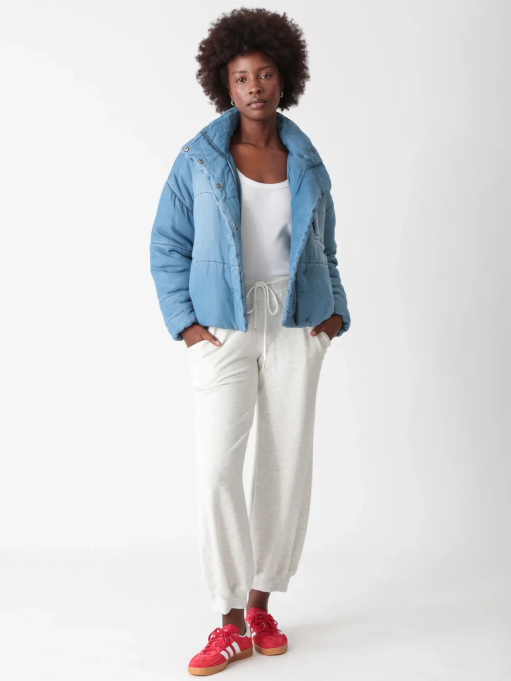 Blue quilted short puffer jacket, featuring a stylish and warm design