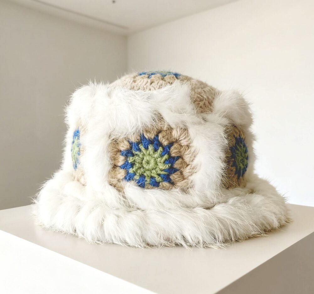 Rabbit fur trimmed crochet winter hat (still life)