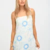 100% linen printed summer slip dress with blue sun and palm tree prints on white background, slip - style design