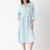 100 - cotton - shirt - dress - light - blue.webp 100% cotton shirt dress in light blue with shirt - style details (collar, buttons, pocket)
