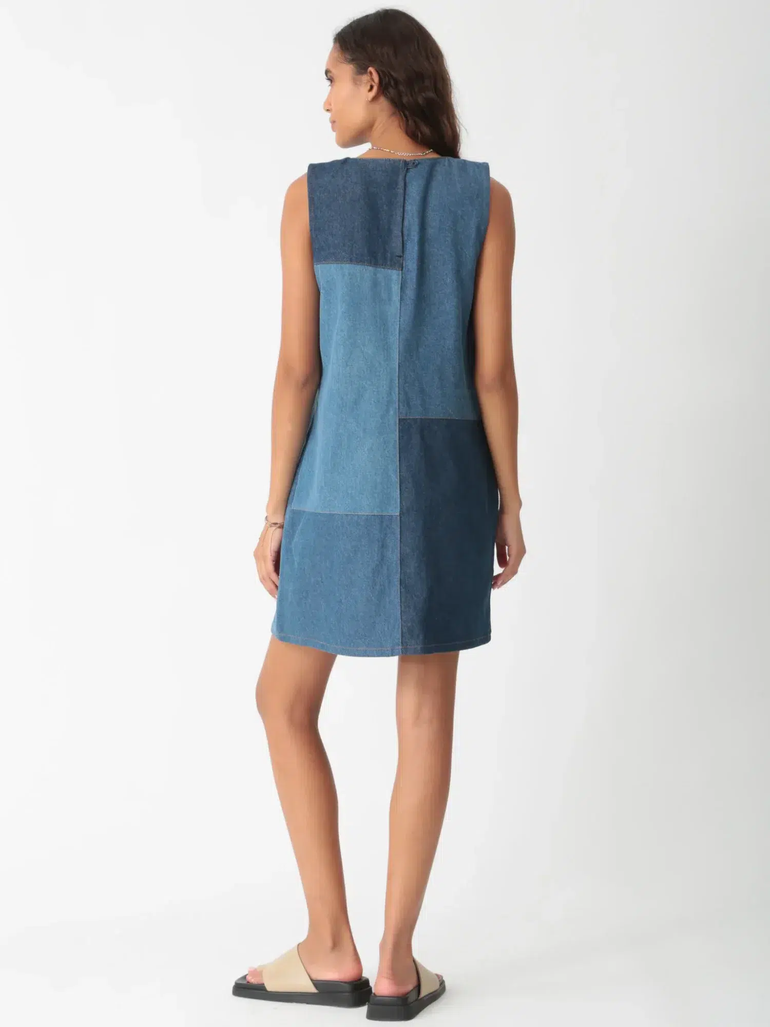 Denim patchwork sleeveless dress with multi - blue denim panels (back view)