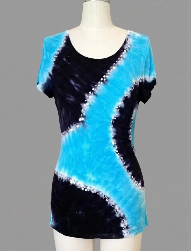 Blue and black tie - dye short sleeve top with rhinestone details displayed on a mannequin against a gray background.