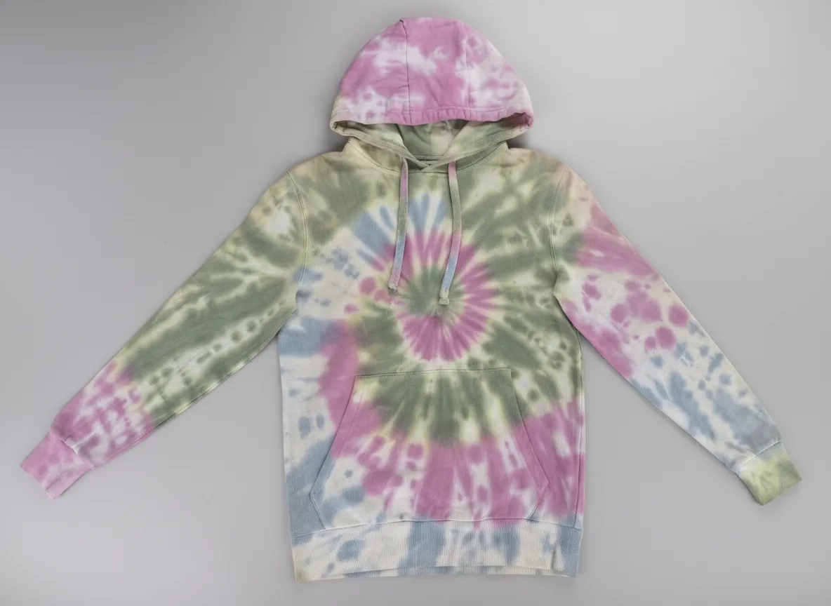 Pastel spiral tie - dye hoodie with a front pocket, displayed against a gray background.