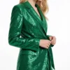 Emerald green sequin wrap blazer worn by model, tie waist design， side view