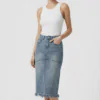 Frayed hem denim midi skirt made of denim fabric, paired with a white tank top, featuring a casual style, suitable for daily wear.