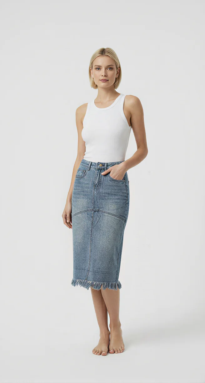 Frayed hem denim midi skirt made of denim fabric, paired with a white tank top, featuring a casual style, suitable for daily wear.