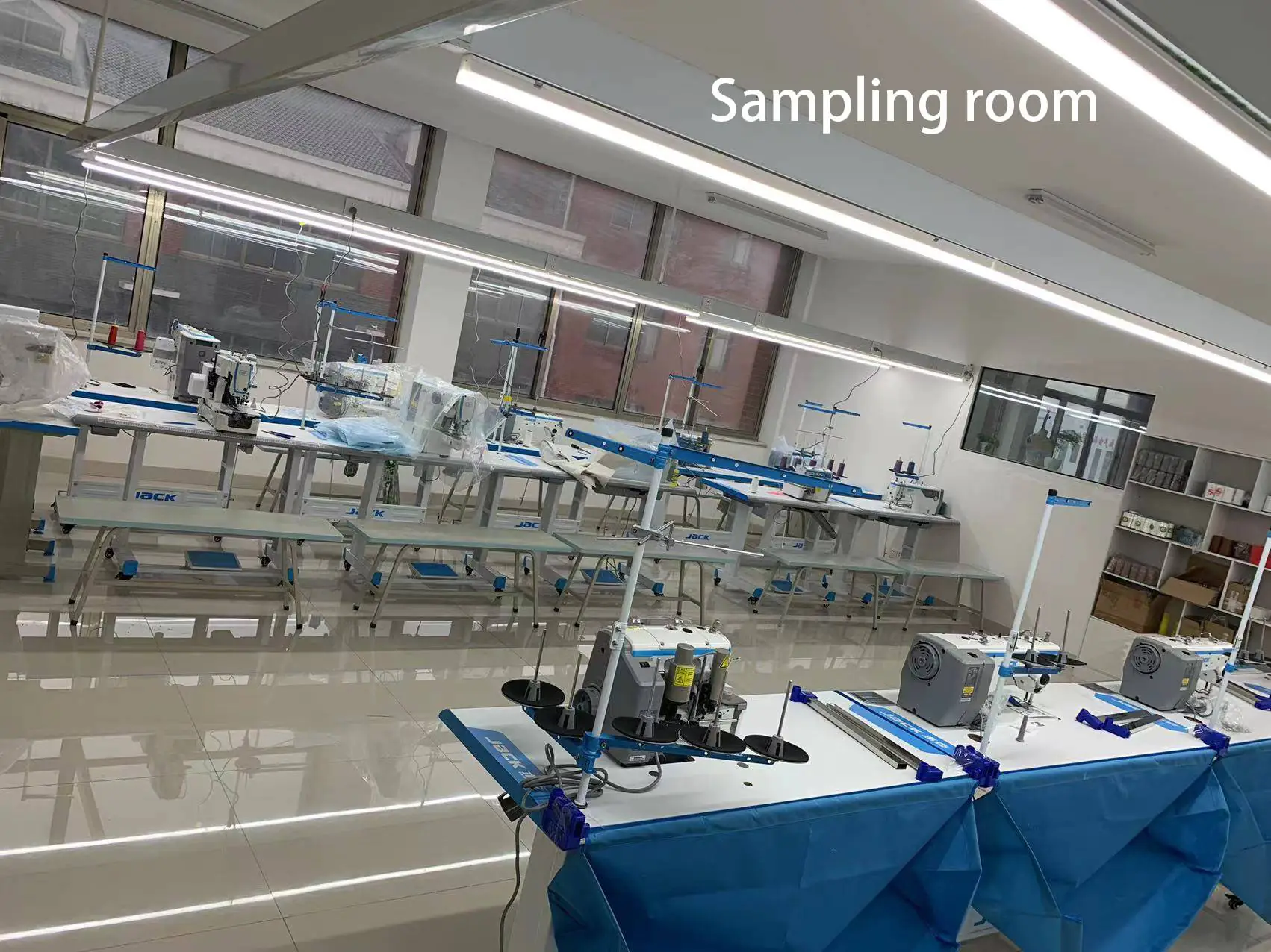 Sewing equipment in sample production workshop with various professional machines, suitable for small-batch sample sewing & process proofing.