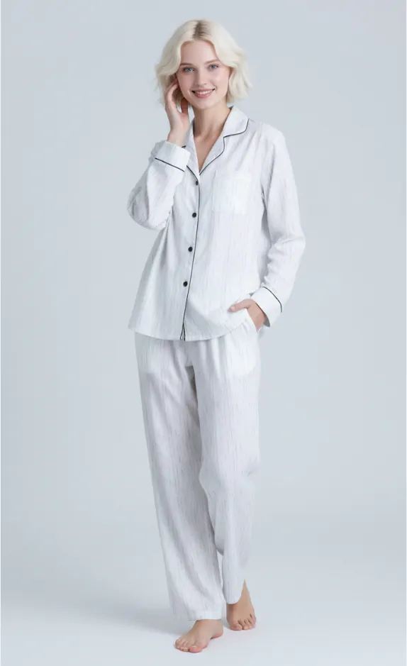 Model wearing white striped pajama set