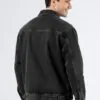 Model wearing oversized charcoal denim utility jacket (back view)
