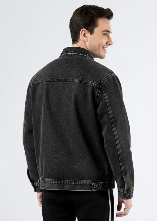 Model wearing oversized charcoal denim utility jacket (back view)