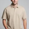 Model wearing beige oversized polo shirt