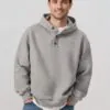 gray-henley-style-hoodie-model-display.jpg Model wearing gray Henley - style hoodie