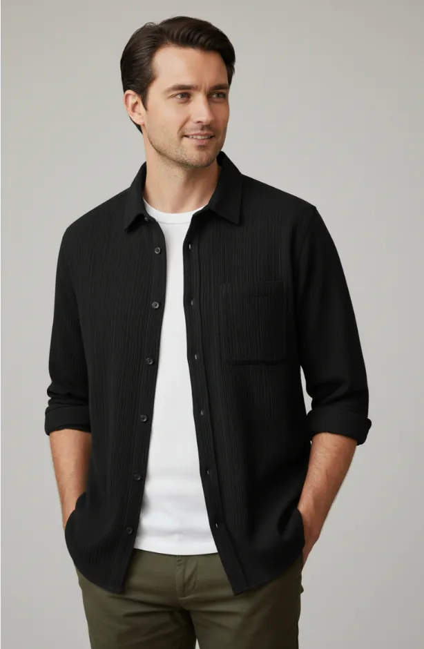 Model wearing black textured button - front shirt