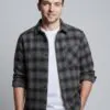 Model wearing black and brown plaid button - front shirt