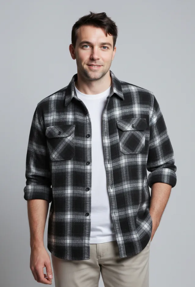 Model wearing black and white plaid button - front shirt