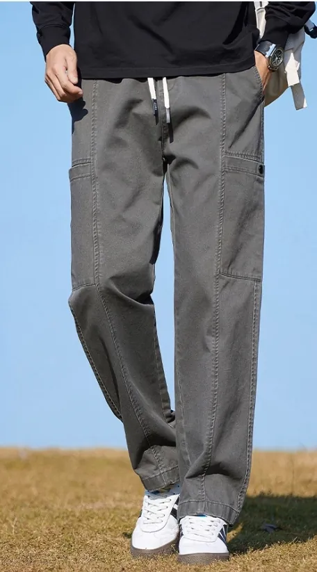 gray-drawstring-cargo-trousers-model-outdoor-side.jpg Model wearing gray drawstring cargo trousers (outdoor side view)
