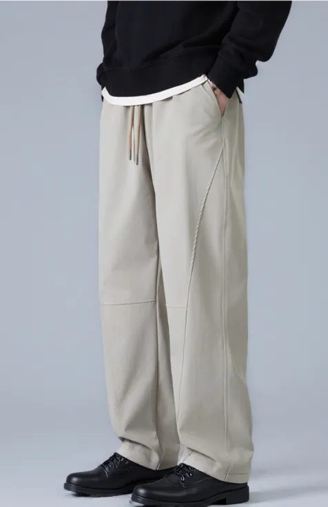 light-beige-drawstring-wide-leg-trousers-model-side.jpg Model wearing light beige drawstring wide-leg trousers (side view)