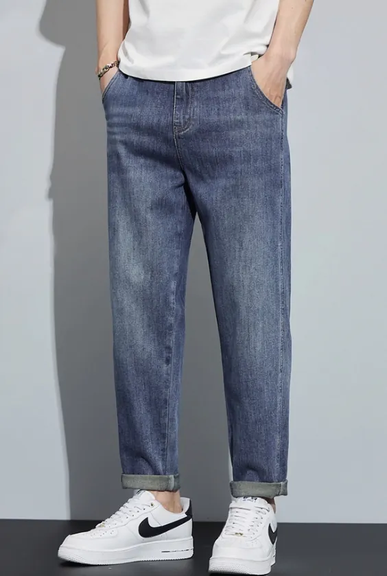 dark-blue-straight-leg-tapered-casual-jeans-model-front.jpg Model wearing dark blue straight-leg tapered casual jeans (front view)