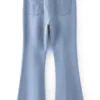 Light blue crossover waist flared jeans with casual and retro - styled design.